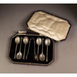 GEORGE V CASED SET OF SIX SILVER SEAL TOP TEASPOONS AND THE MATCHING PAIR OF SUGAR TONGS, case a/