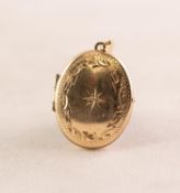 9ct GOLD SMALL ENGRAVED OVAL LOCKET PENDANT, star set with a tiny white stone, 1.9gms