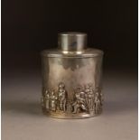 GEORGE V EMBOSSED SILVER TEA CADDY RETAILED BY FINNIGANS OF MANCHESTER, of cylindrical form with