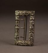 19th CENTURY ORNATE SILVER COLOURED METAL BUCKLE, of oblong form, cast in relief with Middle Eastern