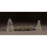 THREE PIECES OF CUT GLASS WITH SILVER COVERS, comprising: OBLONG PIN BOX, with embossed cover, and