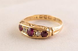 18ct GOLD RING set with three small rubies and two tiny diamonds, 4.1 gms gross