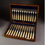 EARLY 20th CENTURY OAK CASED SET OF TWELVE SILVER FISHKNIVES AND FORKS, with bone handles, Sheffield