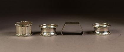 FOUR SILVER NAPKIN RINGS, comprising: A PAIR, Birmingham 1923, ANOTHER, octagonal, marks rubbed