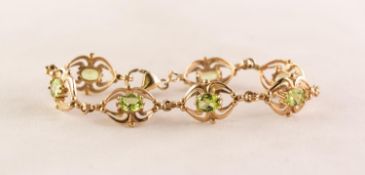 9ct GOLD BRACELET with seven fancy oval openwork links, each set with an oval olivine, lobstyer claw