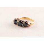 18ct GOLD RING set with three dark sapphires divided with four tiny diamonds, 4.1 gms
