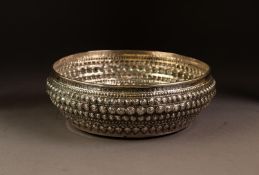 PROBABLY INDIAN EMBOSSED AND ENGRAVED SILVER COLOURED METAL BOWL, of bellied form, decorated with