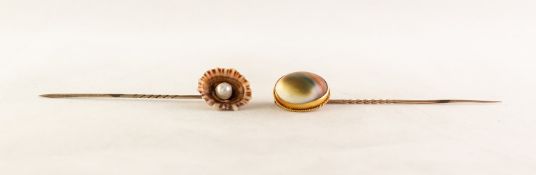 TWO VICTORIAN STICK PINS, one mounted with a natural shell set with a pearl, the other set with a
