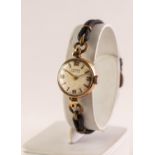 LADY'S VERTEX REVUE 9ct GOLD WRISTWATCH with small circular silvered dial with four arabic