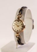 LADY'S VERTEX REVUE 9ct GOLD WRISTWATCH with small circular silvered dial with four arabic