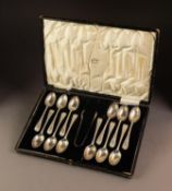GEORGE V CASED SET OF TWELVE SILVER TEASPOONS AND MATCHING PAIR OF SUGAR TONGS, with bright cut