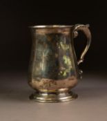 VICTORIAN SILVER TANKARD, of baluster form with leaf capped double scroll handle, 5? (12.7cm)