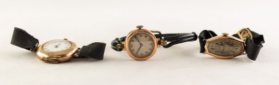 LADY'S 14K GOLD PRE-WAR WRISTWATCH with mechanical movement, narrow oval silvered arabic dial, moire