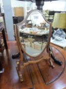 EDWARDIAN MAHOGANY CHEVAL TOILET MIRROR WITH SHIELD SHAPED PLATE AND DECORATED WITH TWO IVORY