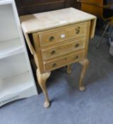 A PINE SEWING TABLE, WITH TWO FALL LEAVES AND THREE DRAWERS, ON CABRIOLE LEGS