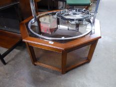 A OCTAGONAL COFFEE TABLE, WITH GLASS INSET TOP AND UNDERTIER