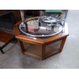 A OCTAGONAL COFFEE TABLE, WITH GLASS INSET TOP AND UNDERTIER