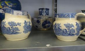 GRADUATED PAIR OF TWENTIETH CENTURY BLUE AND WHITE POTTERY JUGS, ELEPHANT IN GARDEN PATTERN AFTER