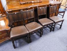 A SET OF FOUR COMMONWEALTH STYLE DINING CHAIRS WITH FRAMED THREE-PANEL BACKS, STUFFED OVER SEATS