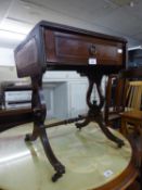 A MAHOGANY OCCASIONAL TABLE IN THE STYLE OF A REGENCY SOFA TABLE, WITH INLET LEATHER TOP