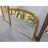 A GILT FRAMED OVERMANTEL WALL MIRROR