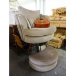 A MODERN GREY FABRIC LOUNGE CHAIR, CIRCULAR WITH WRAPAROUND BACK AND THE FITTING MOON SHAPED, SAME