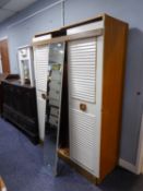 A TEAK AND WHITE FINISH LOUVRED TWO DOOR HANG WARDROBE WITH CENTRE MIRROR PANEL, 3?9? WIDE AND THE
