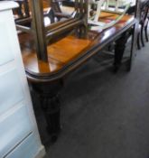 A VICTORIAN MAHOGANY DINING TABLE, EXTENDING WITH A WINDING MECHANISM, ON FOUR TURNED LOBED AND