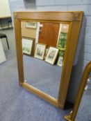 A MODERN GILT FRAMED BEVELLED WALL MIRROR, 43" X 31"