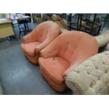 A PAIR OF TUB SHAPED SCOOP BACKED LOUNGE CHAIRS, BUTTON UPHOLSTERED AND COVERED IN PINK FABRIC