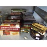 SIX MINT AND BOXED, MAINLY DIE CAST MODELS OF BUSES AND TRAMS; ANOTHER FELTHAM TRAM, (UNBOXED)