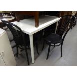 A WHITE FINISH OBLONG KITCHEN TABLE ON METAL POST SUPPORTS, 4' X 2' AND A SET OF FOUR BLACK FINISH