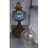 AN OIL TABLE LAMP WITH BLUE GLASS RESERVOIR