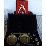 A CASED BRASS BALANCE WITH WEIGHTS, TOGETHER WITH V CLICQUOT LOUSARDINI ? CIGAR CUTTER AND BOTTLE