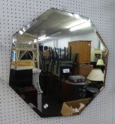 AN OCTAGONAL FRAMELESS WALL MIRROR