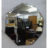 AN OCTAGONAL FRAMELESS WALL MIRROR