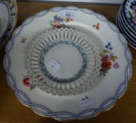 NINETEENTH CENTURY DESSERT PLATES, PAINTED WITH SCATTERED FLOWERS AND A SMALL RIBBON PLATE