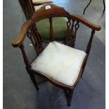 A MAHOGANY CORNER CHAIR WITH 'X' STRETCHER (A.F.)