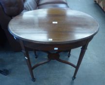 AN OVAL INLAID MAHOGANY OCCASIONAL TABLE WITH 'X' UNDERTIER