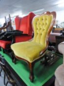 A VICTORIAN STYLE MAHOGANY FRAMED NURSING CHAIR WITH GOLD BUTTON BACK FABRIC