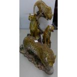LARGE PAINTED RESIN FIGURE OF A LEOPARD ON A SNARLED TREE STUMP, 16" (40.6cm) high, SIMILAR FIGURE