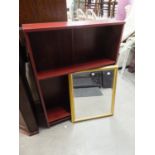 A MAHOGANY EFFECT THREE TIER OPEN BOOKCASE AND AN OBLONG BEVELLED EDGE WALL MIRROR, IN GILT FRAME