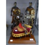 TWO COMPOSITION FIGURES OF CRUSADERS WITH SWORDS AND SHIELDS, 16 ½? HIGH; A RESIN MODEL OF AN