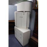 A WHITE LOOM OTTOMAN BOX WITH UPHOLSTERED LID; A MELAMINE CORNER BEDSIDE CUPBOARD AND A WHITE