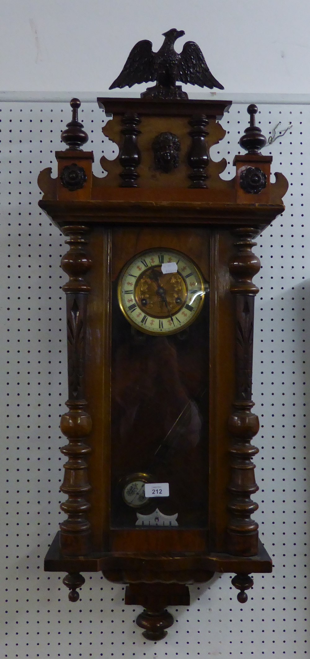 VIENNA STYLE SPRING DRIVEN WALL CLOCK, with grid-iron pendulum and eagle pediment, 39 ½? high