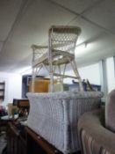 A WHITE WICKER ARMCHAIR AND COFFEE TABLE AND A WICKER STOOL (3)