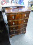 A SMALL REPRODUCTION SERPENTINE FRONT MAHOGANY CHEST OF FOUR DRAWERS
