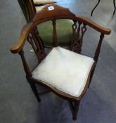A MAHOGANY CORNER CHAIR WITH 'X' STRETCHER (A.F.)