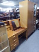 A SUITE OF STAG LIGHT OAK BEDROOM FURNITURE, VIZ A COMBINATION WARDROBE WITH MIRROR; A SINGLE