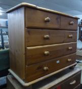 A PINE SMALL CHEST OF TWO SHORT AND THREE LONG DRAWERS, WITH KNOB HANDLES, ON BUN FEET, 2?7? WIDE